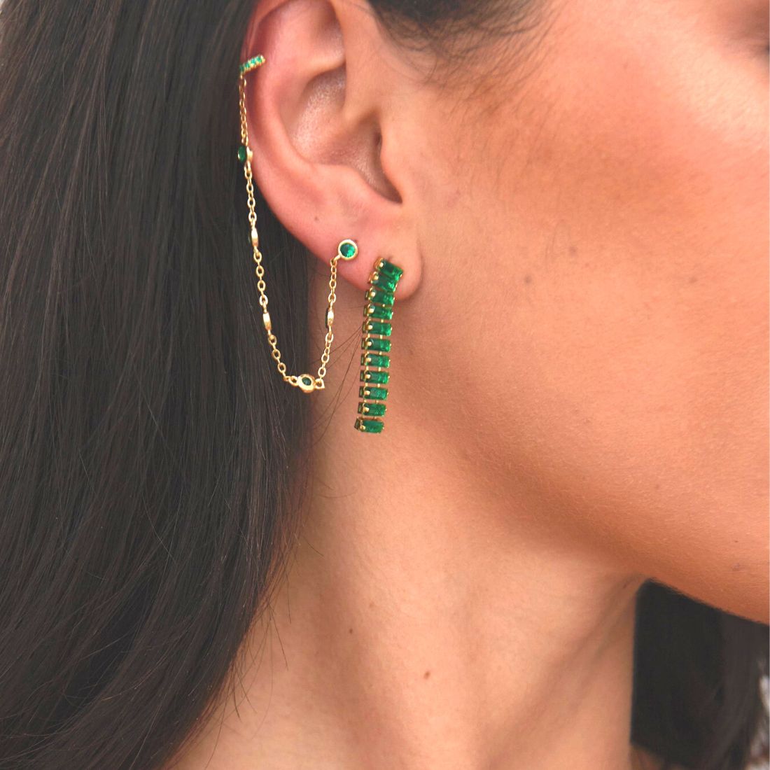Green Emerald Drop Earrings on display